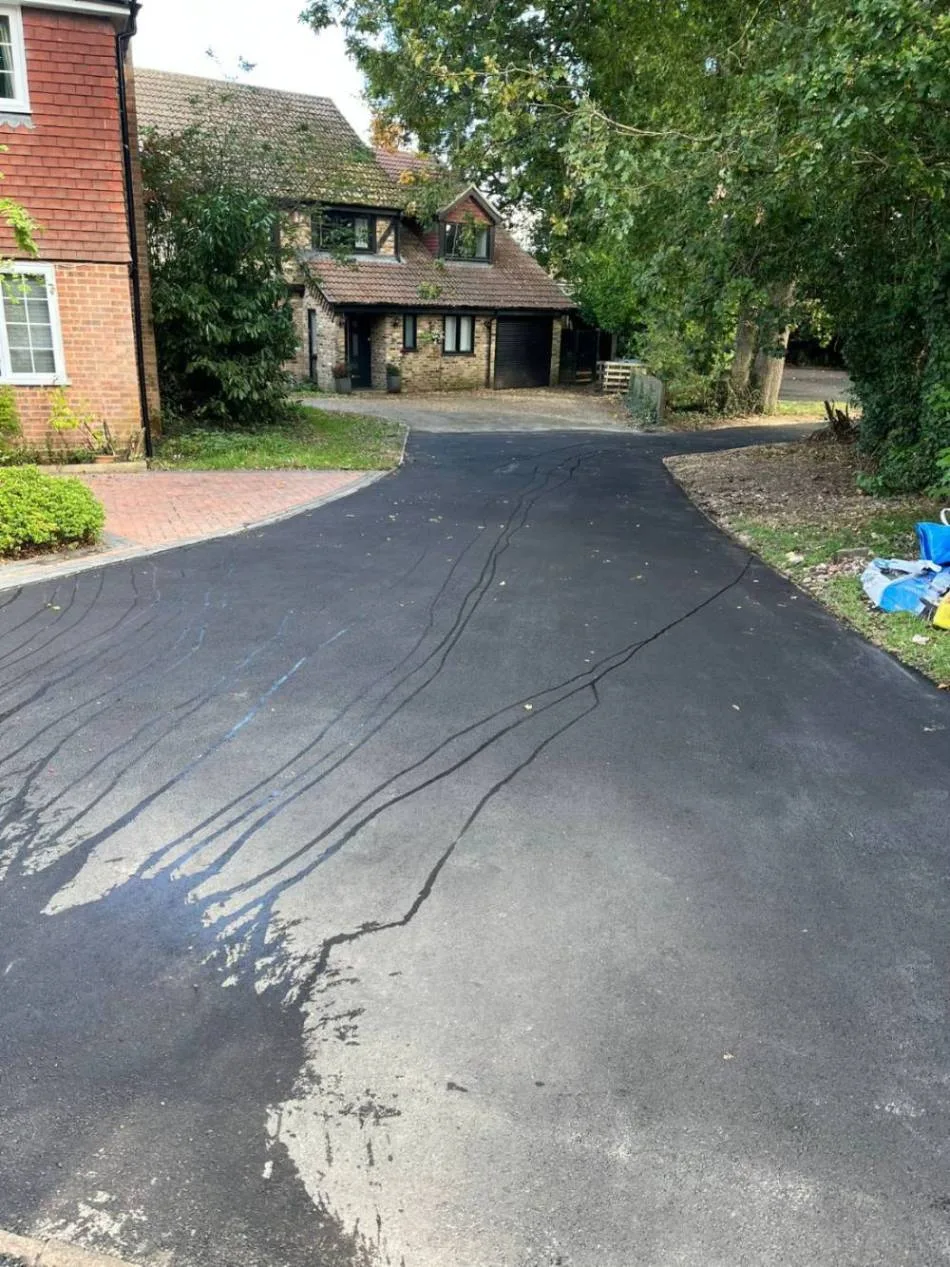 Freshly laid tarmac driveway after resurfacing